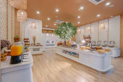 a store with a bakery with a lot of food at Phuket Emerald Beach Resort in Karon Beach