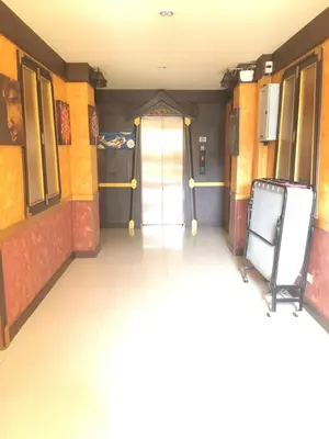 a hallway of a building with a door and a floor at 99 Residence in Patong Beach
