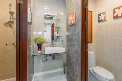 a bathroom with a toilet and a sink at Botan Boutique Hotel in Patong Beach