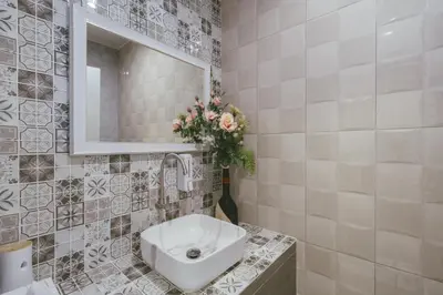a bathroom with a sink and a mirror at Botan Boutique Hotel in Patong Beach