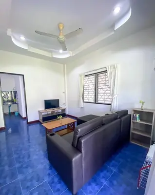 a living room with a couch and a table at Karon House 15C in Karon Beach