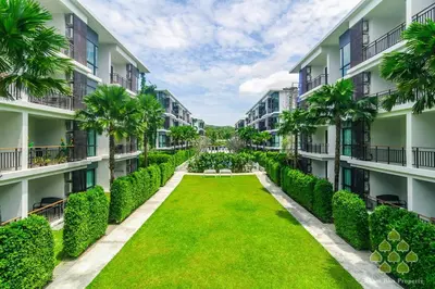 anterior view of the courtyard of an apartment building at Direct pool access 2br apartment @The Title Rawai in Rawai Beach