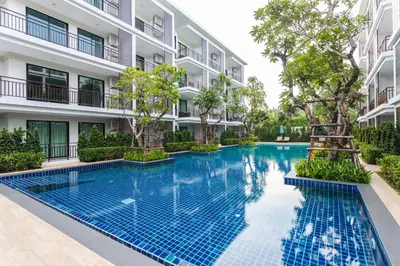 an image of a swimming pool in front of a building at Direct pool access 2br apartment @The Title Rawai in Rawai Beach