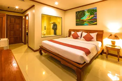 a bedroom with a large bed in a room at Patong Heaven in Patong Beach