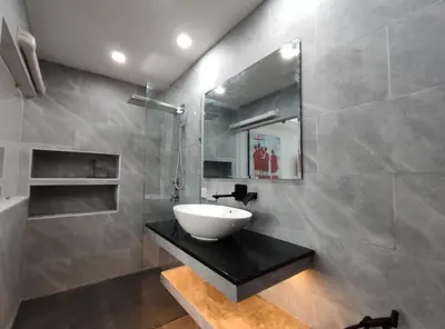a bathroom with a sink and a mirror at Sawansa 34A Modern Luxury 3BR Sea View 450m2 in Patong Beach