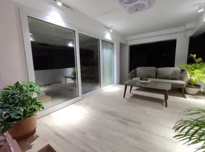 a living room with a couch and a table at Sawansa 34A Modern Luxury 3BR Sea View 450m2 in Patong Beach