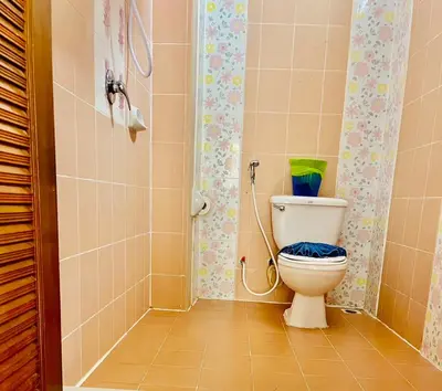 a bathroom with a toilet and a shower at Innarm House Patong in Patong Beach