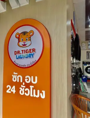an orange sign in a store with a monkey on it at Innarm House Patong in Patong Beach