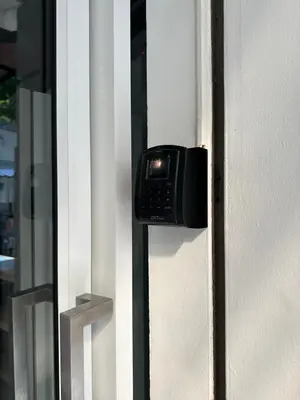 a phone is attached to the side of a door at Blue Flow Hostel in Phi Phi Don