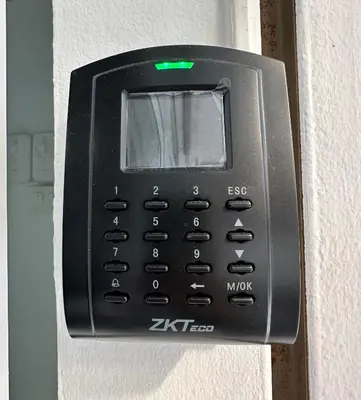 a black cell phone is attached to a wall at Blue Flow Hostel in Phi Phi Don