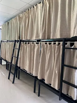 a row of curtains in a room at Blue Flow Hostel in Phi Phi Don