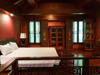 a bedroom with a large bed in a room with windows at Patong 4BD sea view BOOM party&cozy pool villa in Ban Nakhale