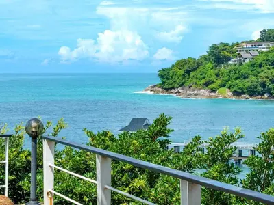 a view of the ocean from a balcony at Patong 4BD sea view BOOM party&cozy pool villa in Ban Nakhale