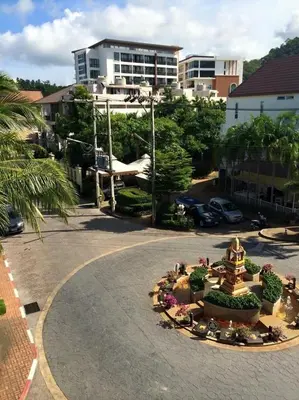 a large fountain in the middle of a street at Glitter House Phuket in Kata Beach