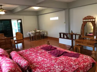 a living room with a large bed and a table at Apartment kata in Kata Beach