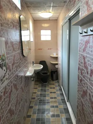 a bathroom with a toilet and a sink at Apartment kata in Kata Beach