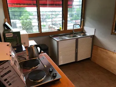 a kitchen with a sink and a stove top oven at Apartment kata in Kata Beach