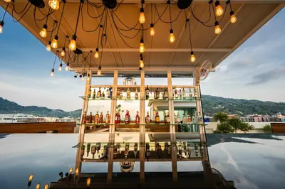 a bar on the roof of a building with lights at La Vista Patong Hotel in Patong Beach