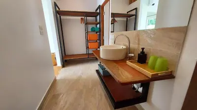 a bathroom with a sink on a wooden counter at 8 Palm Villa - Large Private Pool Villas in Aonang in Ao Nang Beach