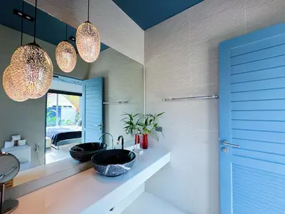 a bathroom with a sink and a mirror at Contemporary 3bd Safari Pool Villa Near Nai Yang Beach in Ban Bo Han