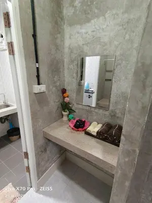 a bathroom with a sink and a mirror at Da-Kanda Boutique in Klong Muang Beach