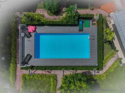 an overhead view of a swimming pool in a yard at Da-Kanda Boutique in Klong Muang Beach