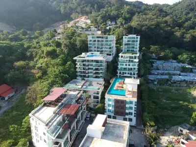 an aerial view of tall buildings in a city at Sea view apartment at The Privilege by Lofty in Patong Beach