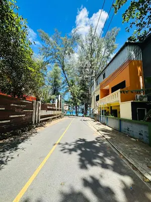 an empty street in a town with a building at Brand Naithon CondoC404 in Nai Thon Beach
