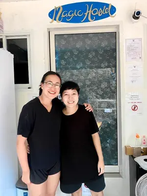 a man and a woman posing for a picture at Magic Hostel in Phi Phi Don