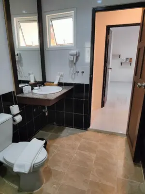 a bathroom with a toilet and a sink and a shower at Phuket Jungle Experience Resort in Karon Beach