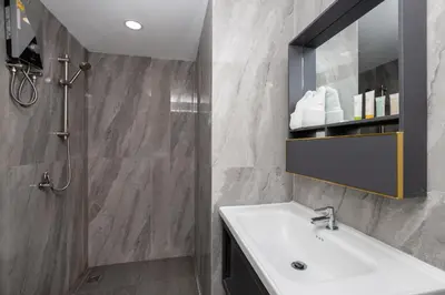 a bathroom with a sink and a shower at iCheck inn Darisa Patong in Patong Beach