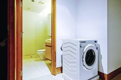 a washing machine in a bathroom with a toilet at Beachfront 2br home with private plunge pool on stunning Naithon beach 3 in Nai Thon Beach