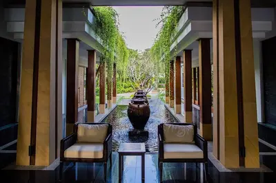 a hallway with two chairs and a vase in the middle at Beachfront 2br home with private plunge pool on stunning Naithon beach 3 in Nai Thon Beach