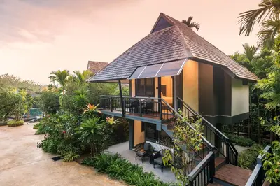 a house with a gambrel roof at Loy Chalet in Klong Muang Beach