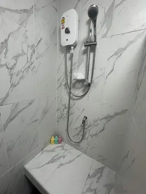 a bathroom with a shower and a sink at Sari Boutique hotel in Patong Beach