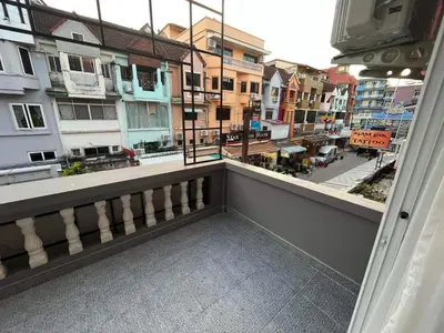a balcony with a view of a city with buildings at Sari Boutique hotel in Patong Beach