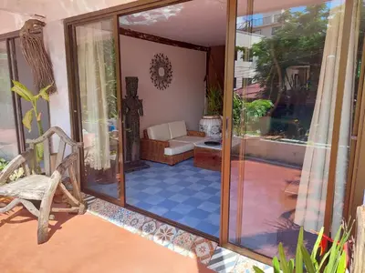 an internal view of a house with a glass door at Baan sikhao Yanui in Rawai Beach