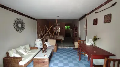 a living room with a couch and a table at Baan sikhao Yanui in Rawai Beach