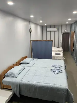 a bedroom with a large bed in a room at Hunny Home in Ko Yao Noi