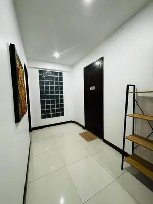 a room with a door and a tiled floor at Sunrise Villa 21 in Phuket Town