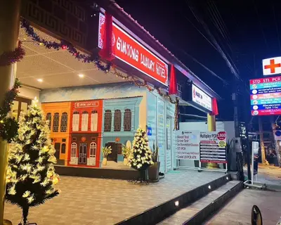 a store front with a christmas tree in front of it at Sunray Beach Hotel Patong in Patong Beach