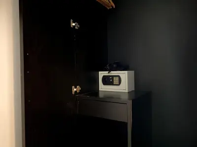 a microwave sitting on top of a table in a room at Sunray Beach Hotel Patong in Patong Beach