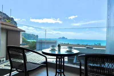 a table and chairs on a balcony with a view of the ocean at A402-Silk Condo Aonang-Sea view-5 mins walk to beach in Ao Nang Beach