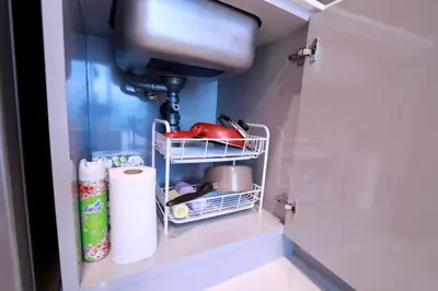 a kitchen with a sink and a shelf with dishes at A402-Silk Condo Aonang-Sea view-5 mins walk to beach in Ao Nang Beach