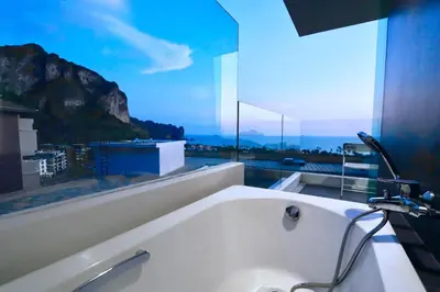 a bathroom with a bath tub with a large window at A402-Silk Condo Aonang-Sea view-5 mins walk to beach in Ao Nang Beach