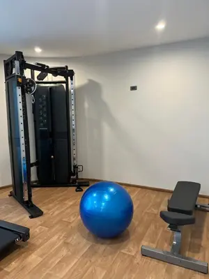 an exercise room with a blue ball and a gym at Seaside vacation in Rawai Beach