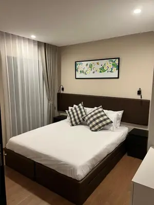 a bedroom with a bed with two pillows on it at Seaside vacation in Rawai Beach