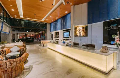 a lobby with couches and chairs in a building at The Beach Heights Condotel Kata 500 meters to Kata beach in Kata Beach