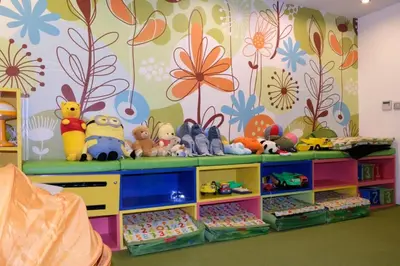 a room with a shelf with stuffed animals on it at The Beach Heights Condotel Kata 500 meters to Kata beach in Kata Beach