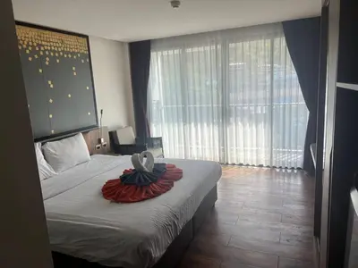 a bedroom with a bed with a bowl on it at The Beach Heights Condotel Kata 500 meters to Kata beach in Kata Beach